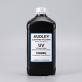 A 1000ml bottle of Audley UV Inkjet Printer Cleaning Solution, featuring a black plastic bottle with a white cap and a white label with blue borders.